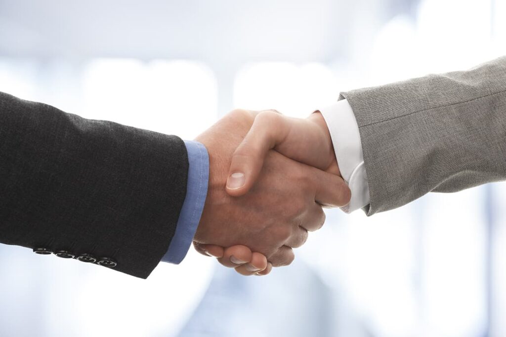 Two business men shaking hands